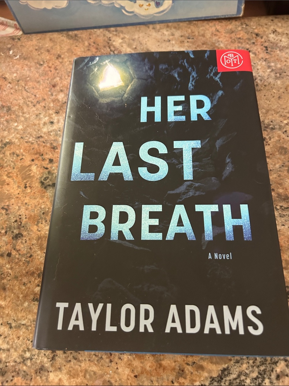 Her Last Breath by Taylor Adams - Black & Blue Hardcover Novel